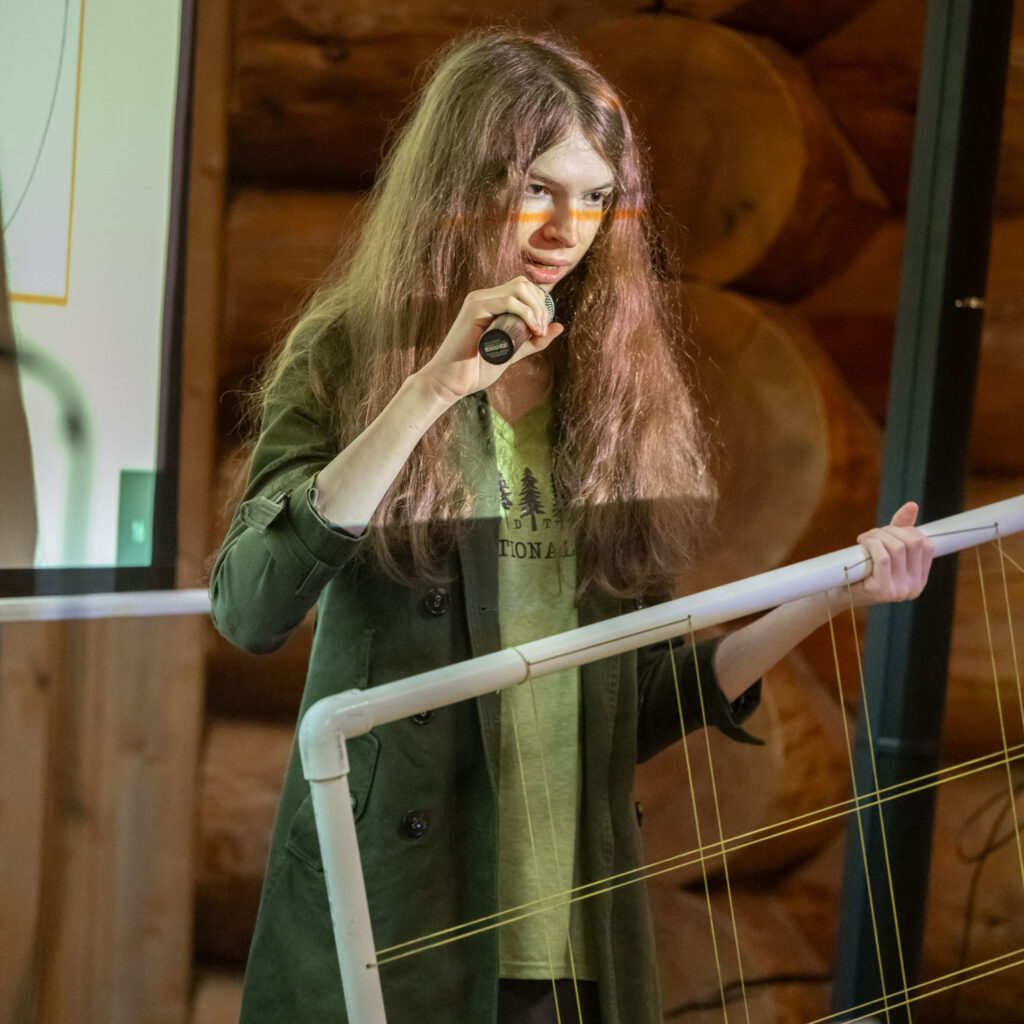 A person speaking into a microphone.