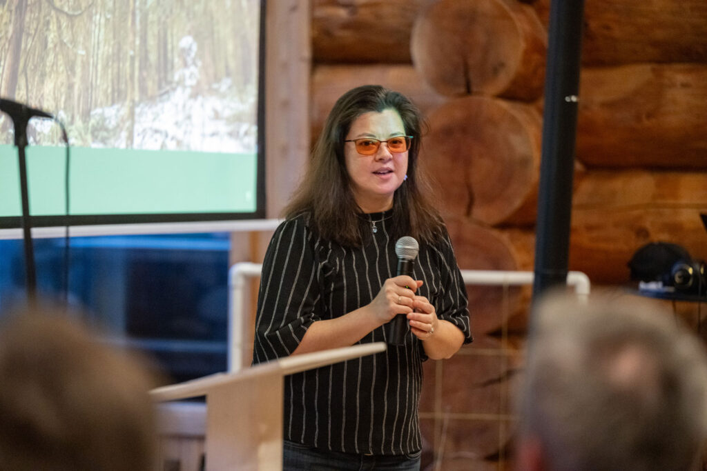 A person presenting to a crowd.