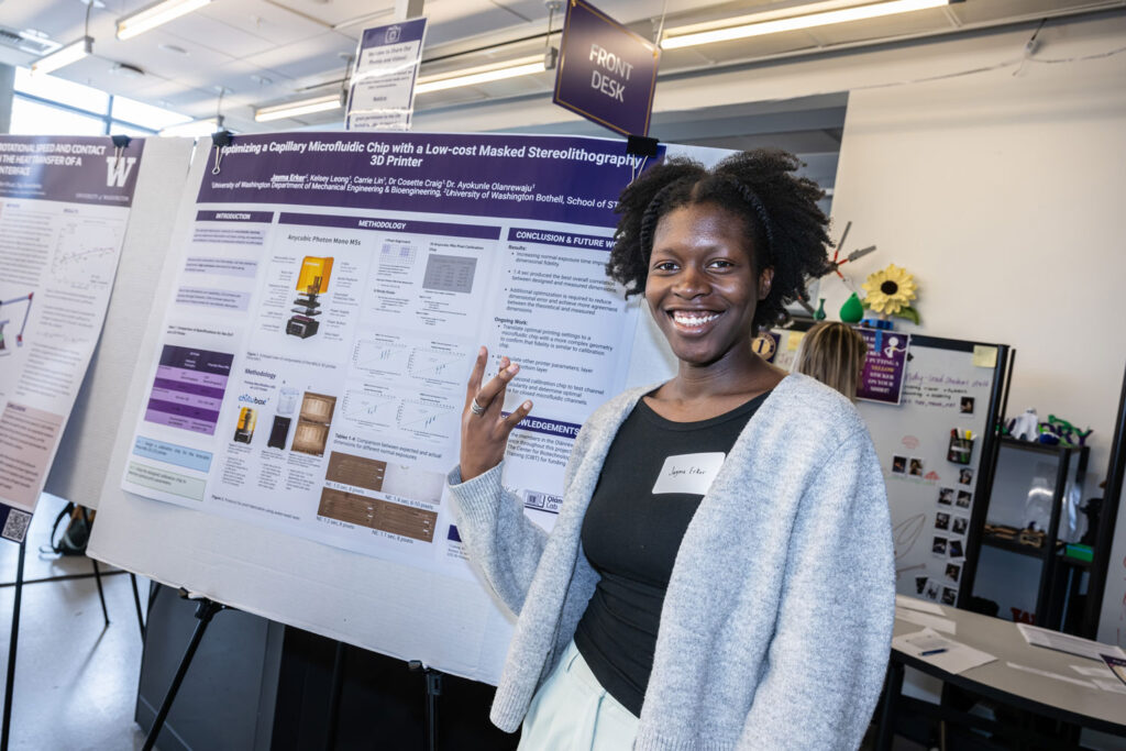 A person next to a poster.