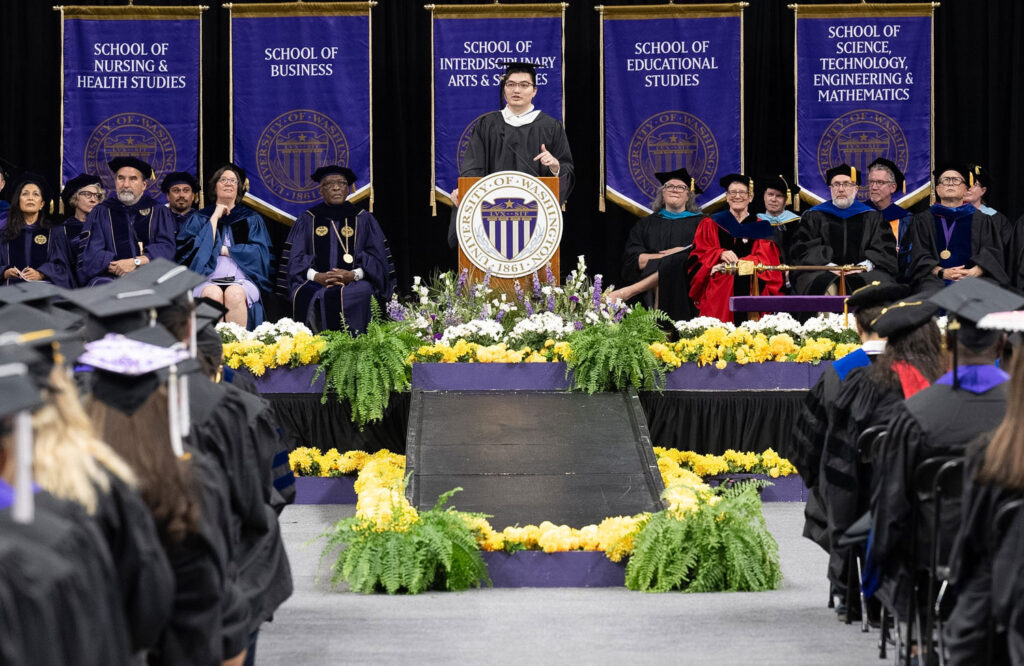 A person speaking at a podium.