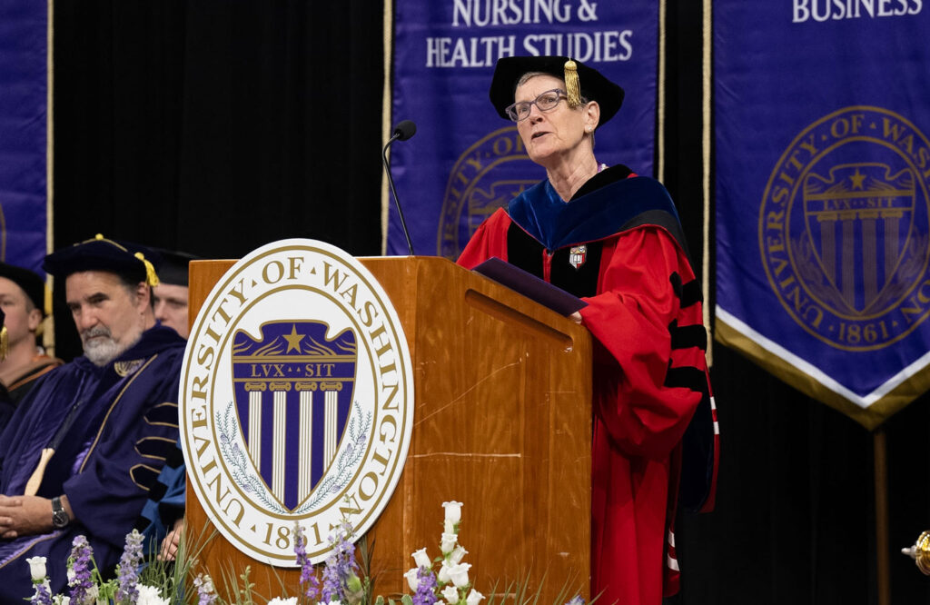 A person at a podium speaking.