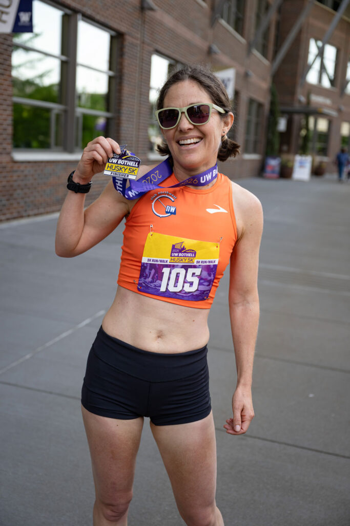 A person holding a medal.
