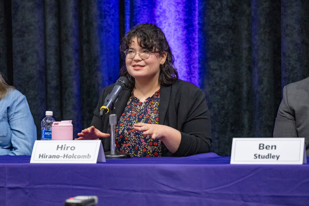 A person at a panel. 
