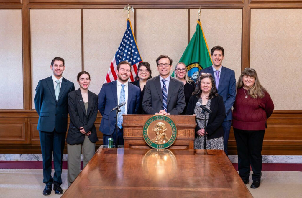A group of people behind a podium.