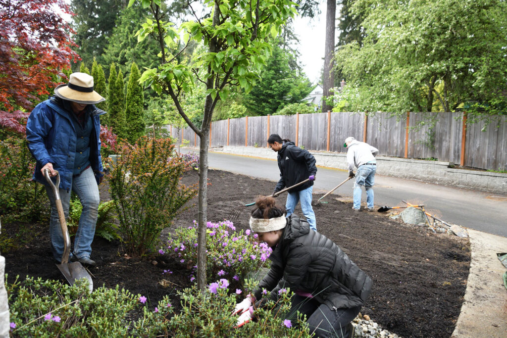 People doing yard work.