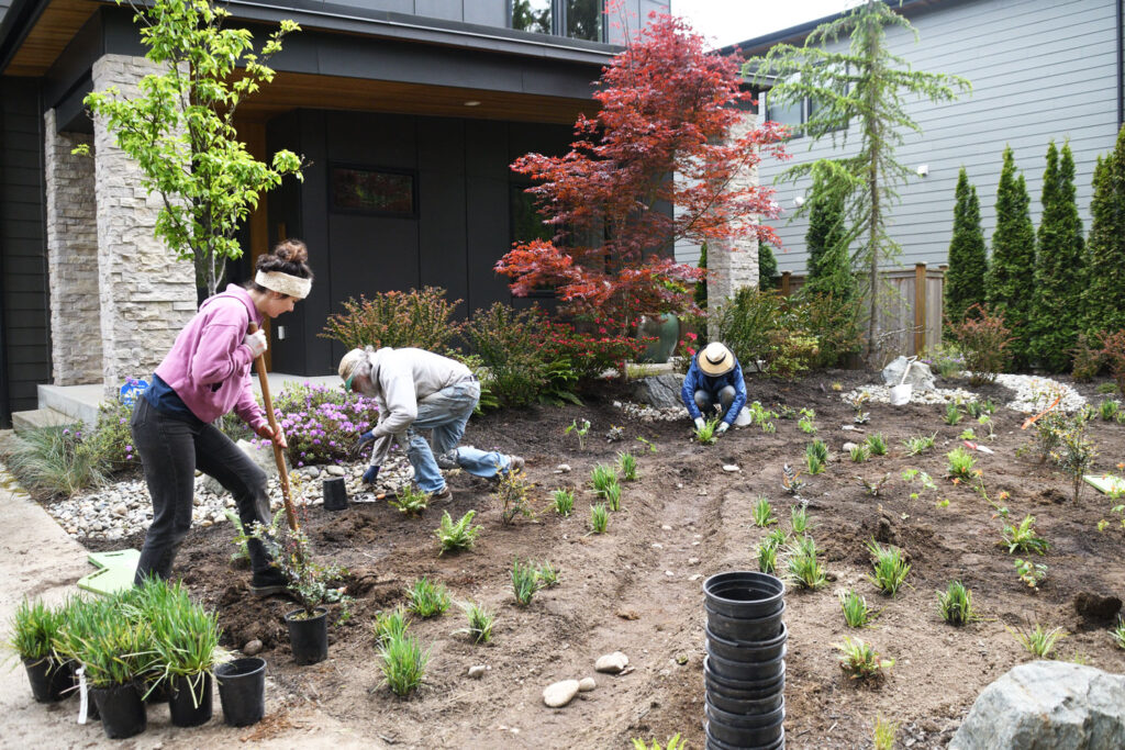 People doing yard work.
