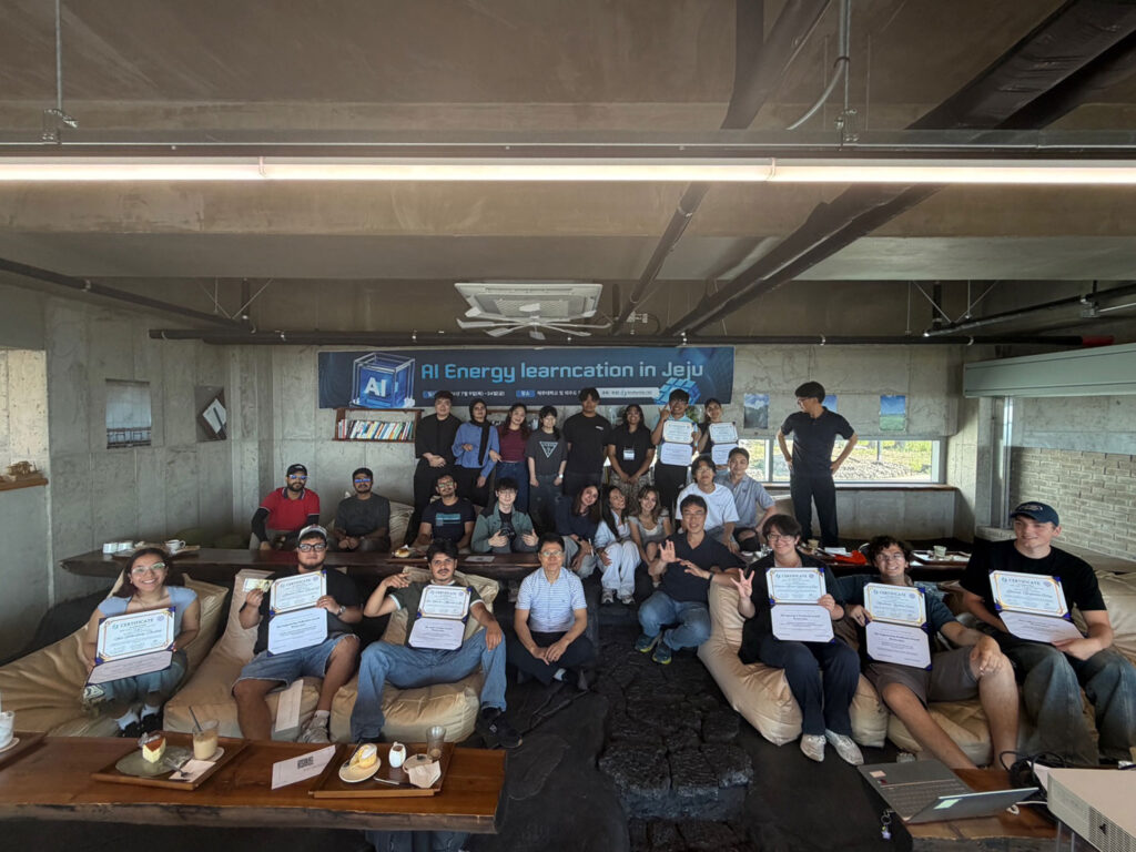 A group of people holding up certificates.