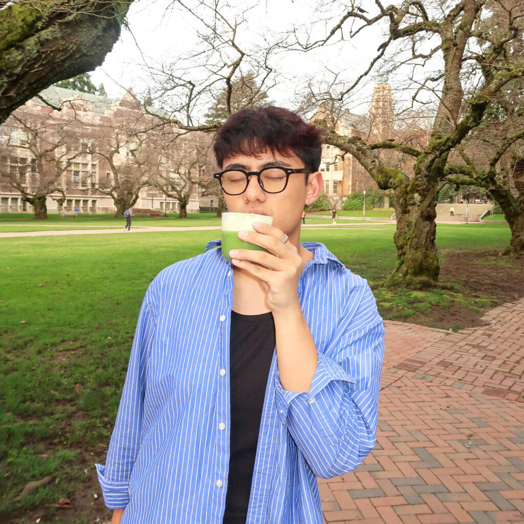 A person drinking matcha.