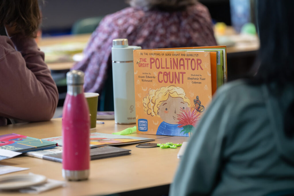 A book titled "The Great Pollinator Count" on a table.
