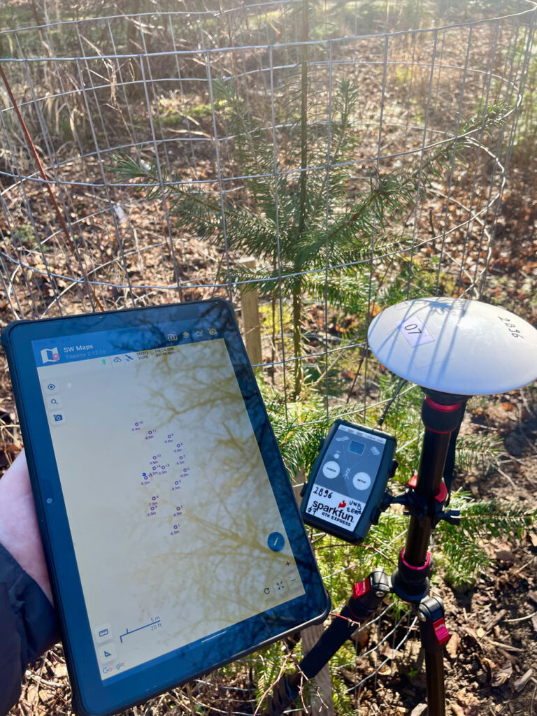 An ipad next to a GIS device.