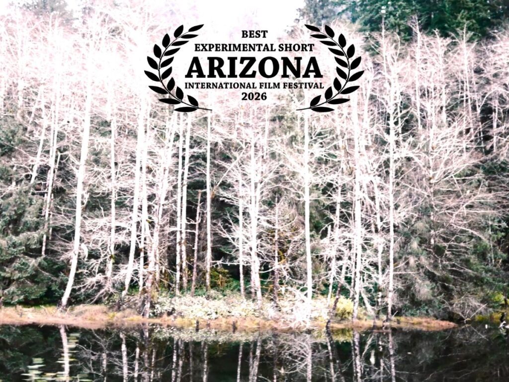 A view of trees with text that reads "Best Experimental Short, Arizona International Film Festival 2026."