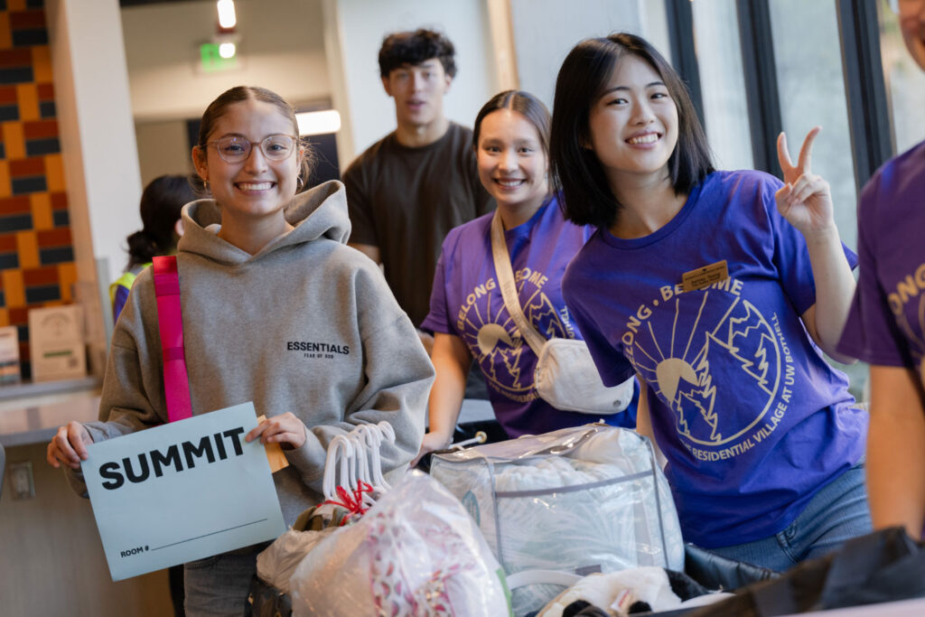 People holding boxes and items.