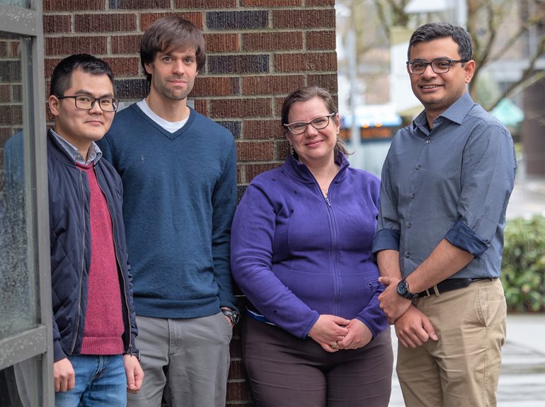 A group of people pose together.