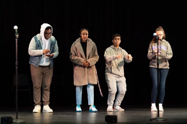 Four people on a stage.
