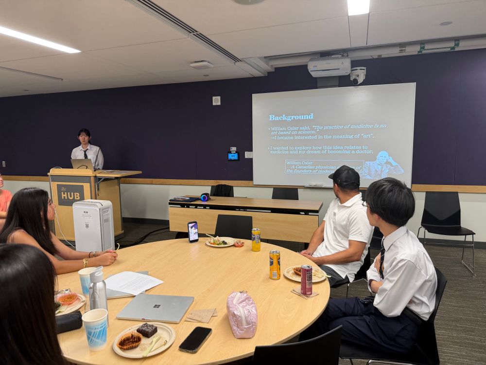student presenting at podium