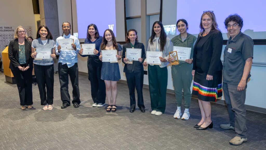 Bio division chair, seven students with certificates, the dean and a faculty member