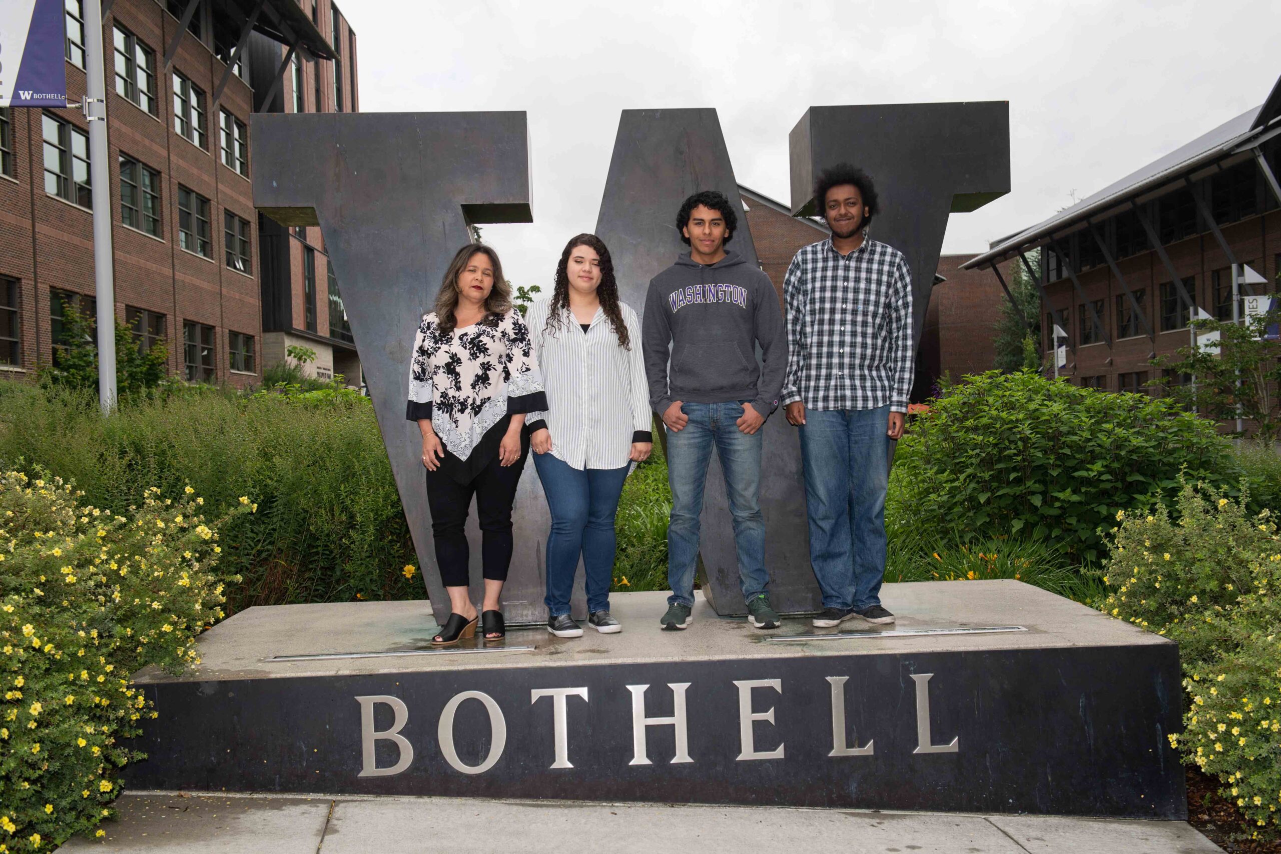 Optimization group with their faculty mentor at the W Bothell statue