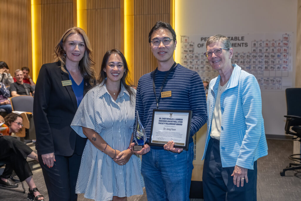 From left to right: Dean Jennifer McLoud-Mann, Michelle Gamboa. Dr. Jong Yoon and Chancellor Kristin G. Esterberg. Dr. Jong Yoon holds certificate and glass award, shaped like a water drop