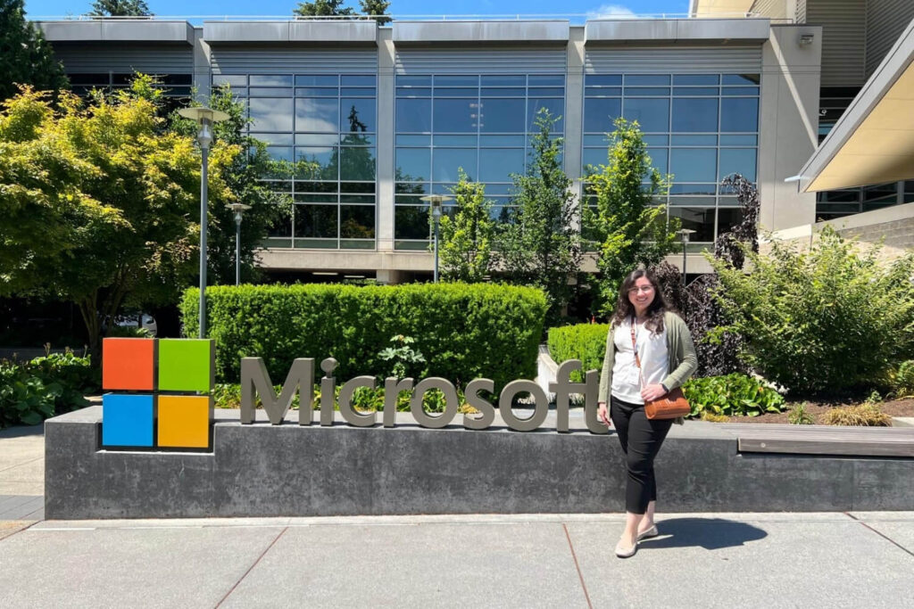 Brenda standing next to a Microsoft sign.