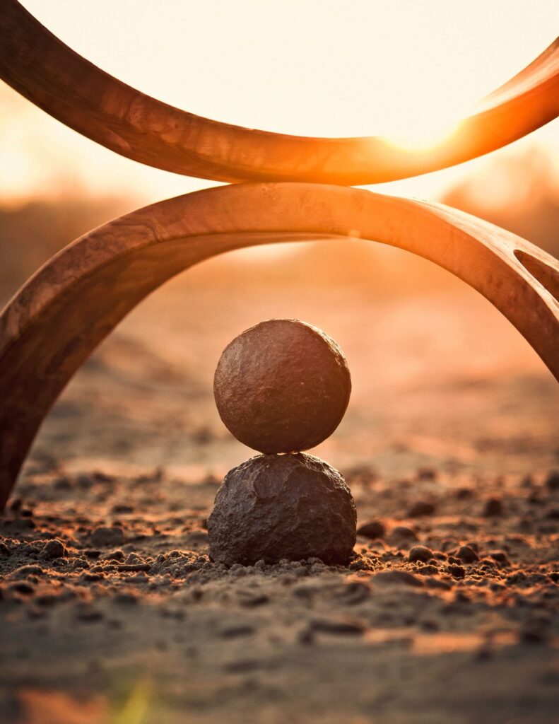 Sculpture with the sun blurred in background