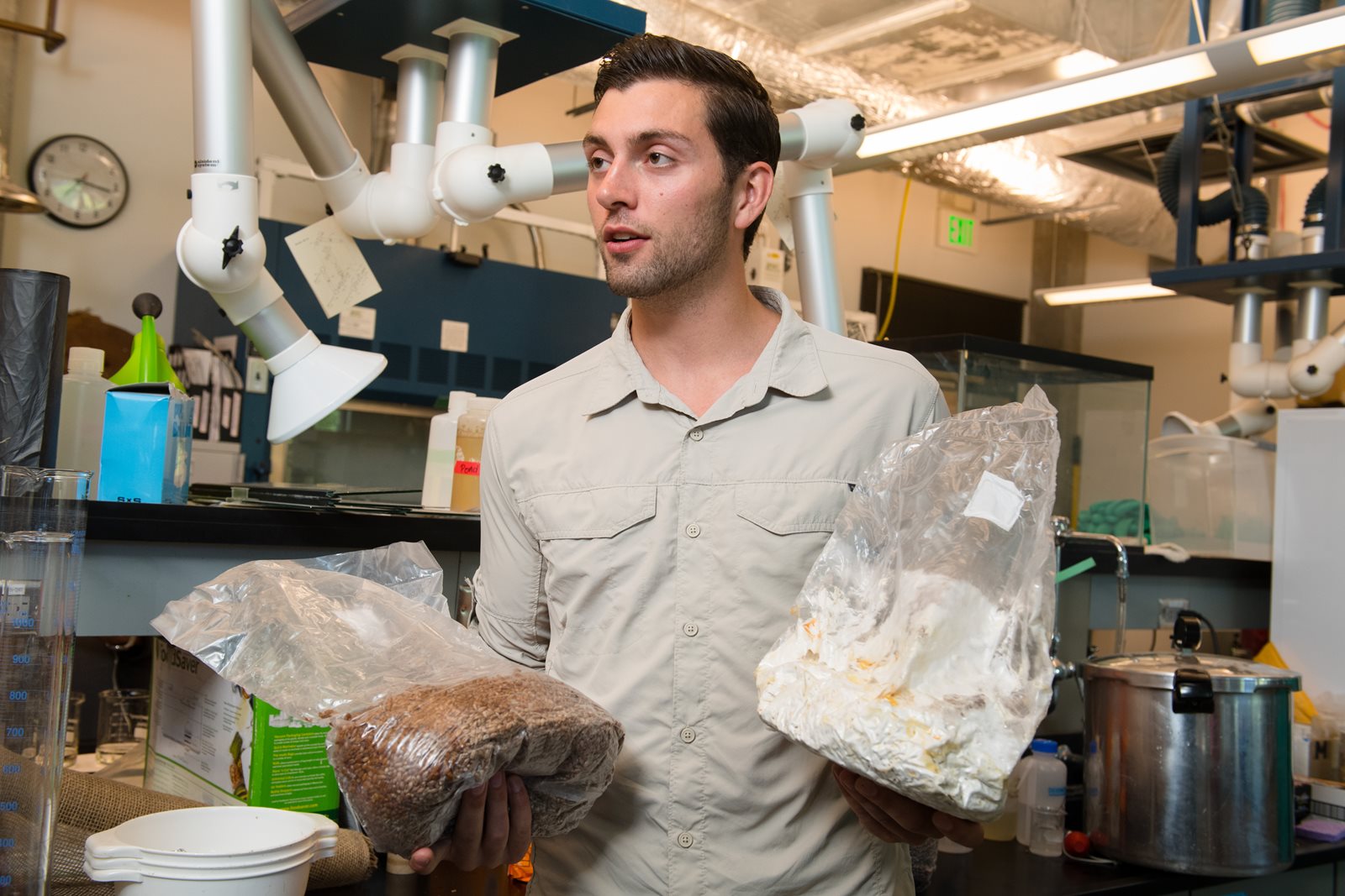 Kellen Maloney with bag of mycelium