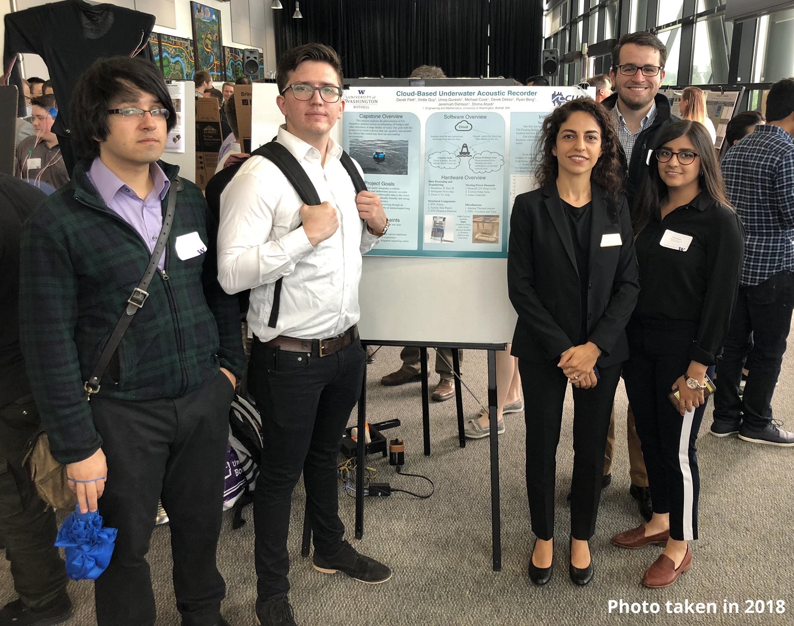 Shima Abadit with 2018 capstone team of four other people presenting poster