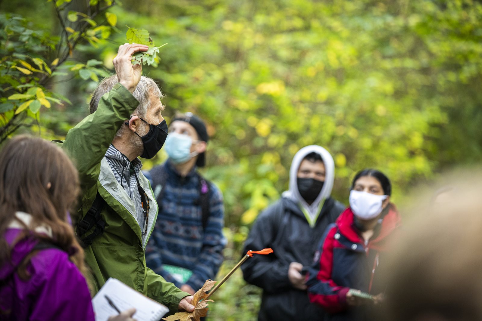 UW Bothell faculty member teaching to group of students outside