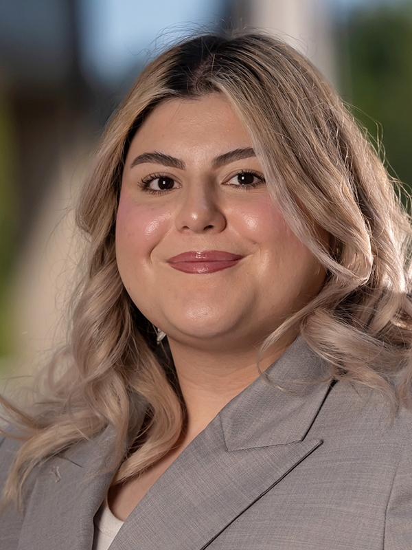 Close-up portrait of Lauren Castellon wearing a grey blazer.