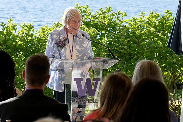 Anne Loustau speaking in front of a crowd at the 2026 Recognition Reception.