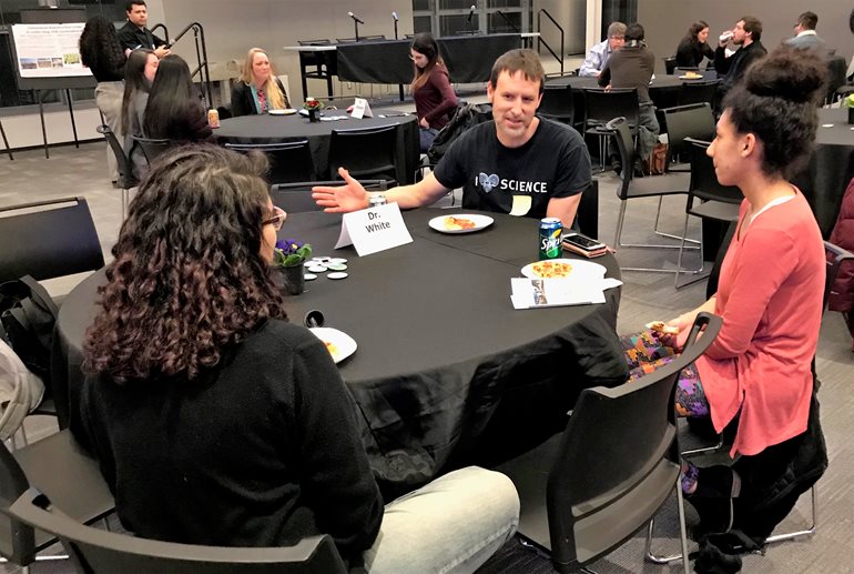 Bryan White talks with students.