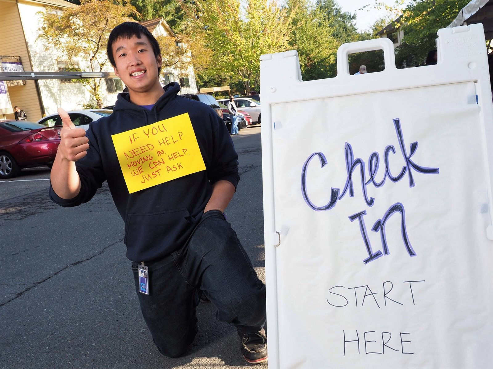 Jeffrey Leung offers to help residents moving in.
