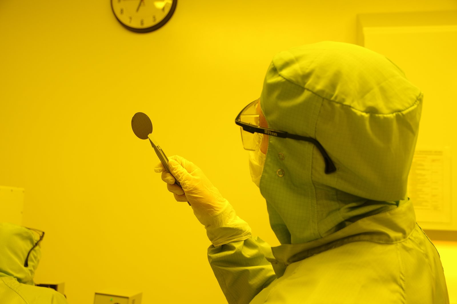 Examining silicon wafer in clean room