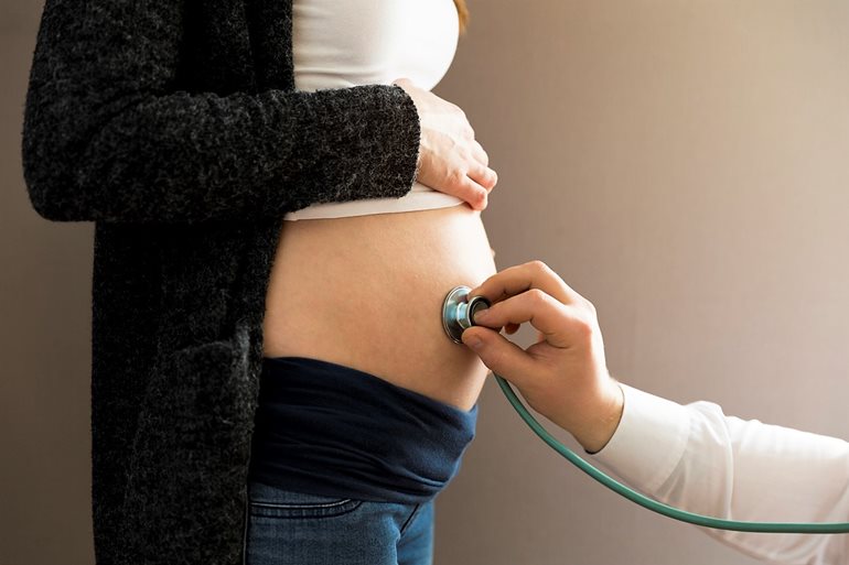 Stethoscope on woman who is pregnant