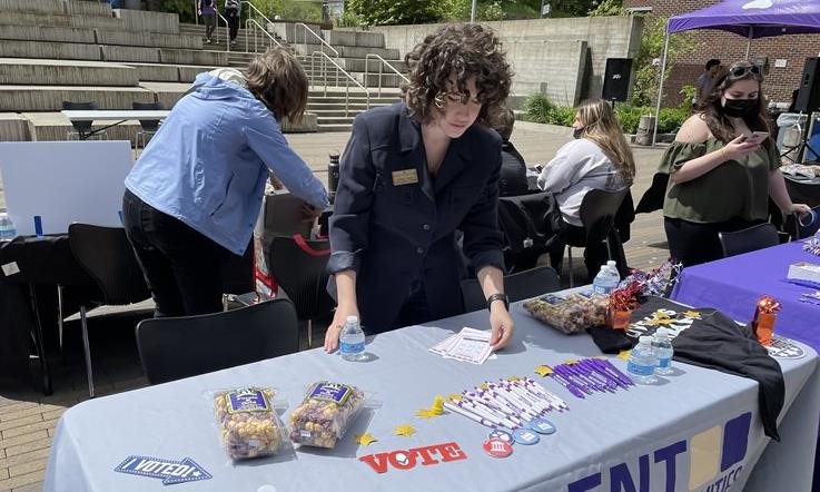 Rosen setting up a table at the legislative fair