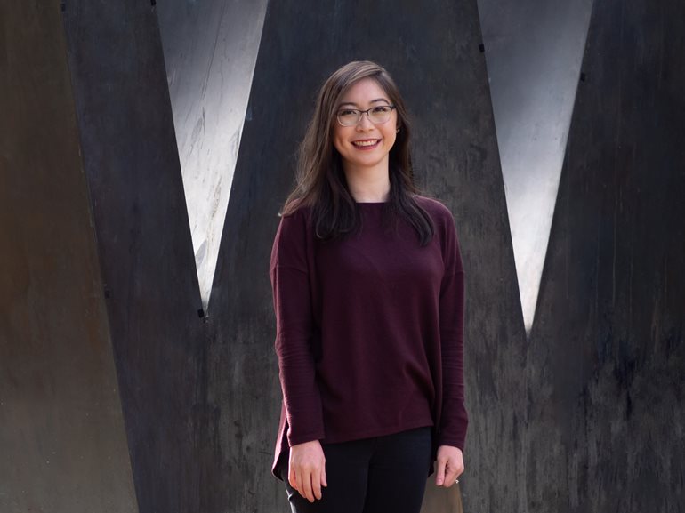 Mei Louie, student in the Master of Nursing program, smiling in front of the 