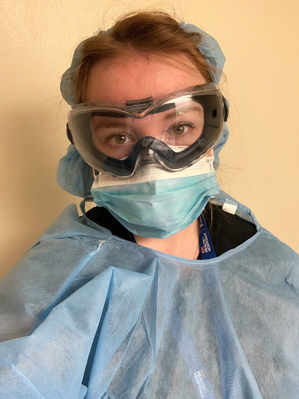 Avery Montes De Oca wearing a mask, goggles, and scrubs