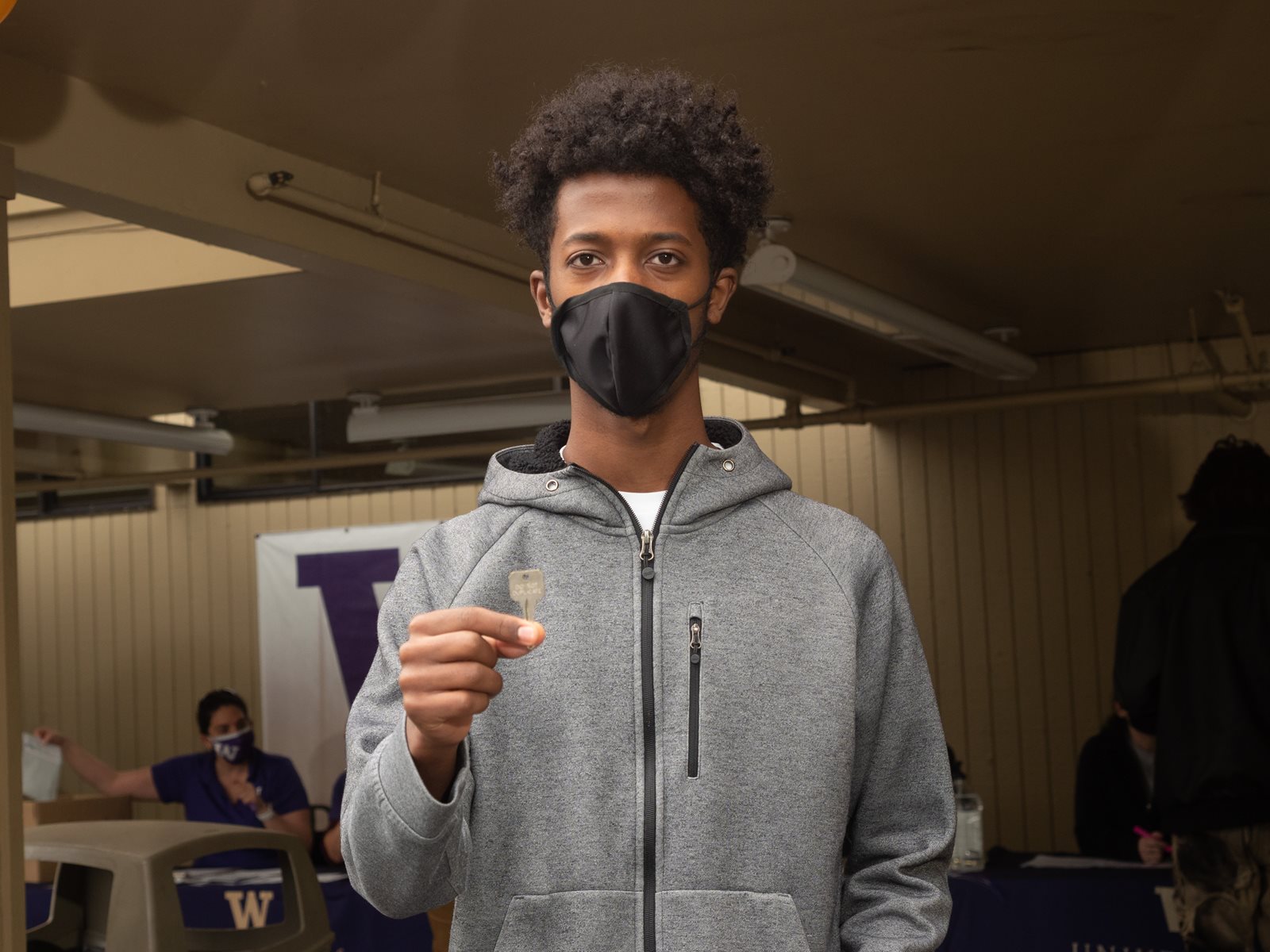 A male student holding a key