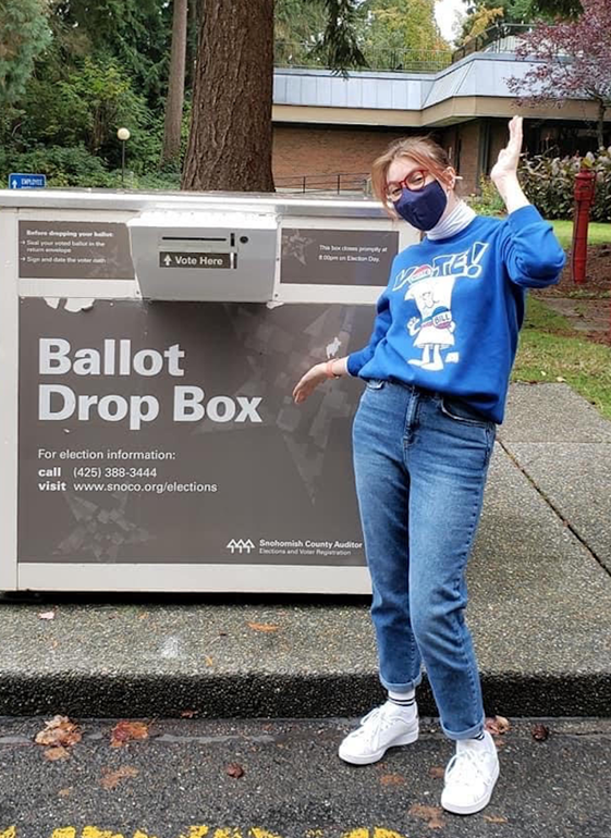 Sam Locke dropping her ballot in the drop box