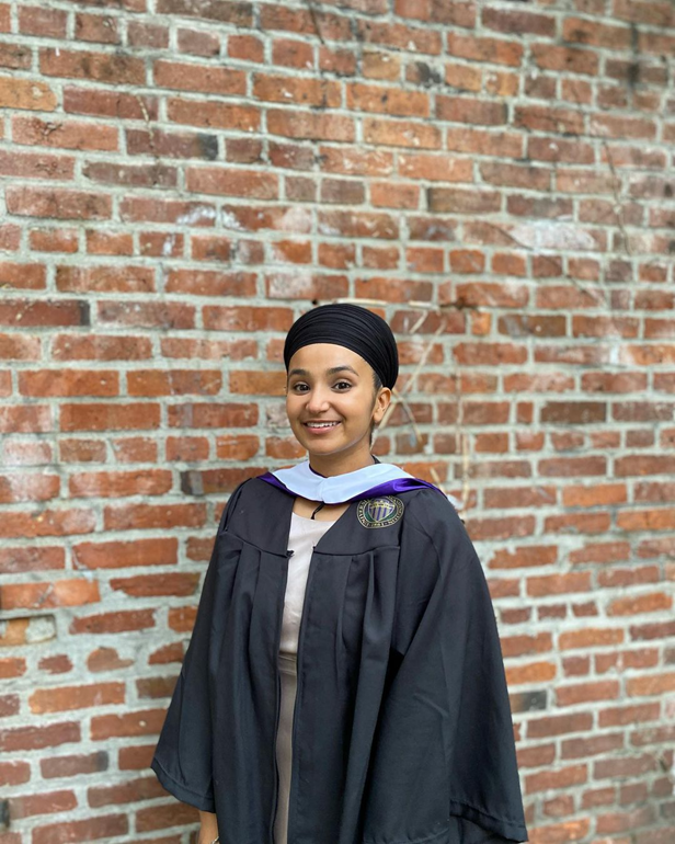 Sharndeep Shoker smiling in graduation regalia 