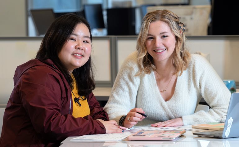 Student, left, consulting with Elizabeth Boone.